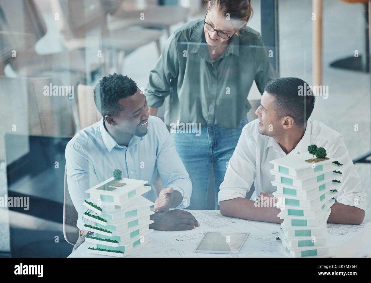 Architecture, 3d building and engineer people meeting for business industrial planning, model analysis or b2b project collaboration. Teamwork, ideas Stock Photo