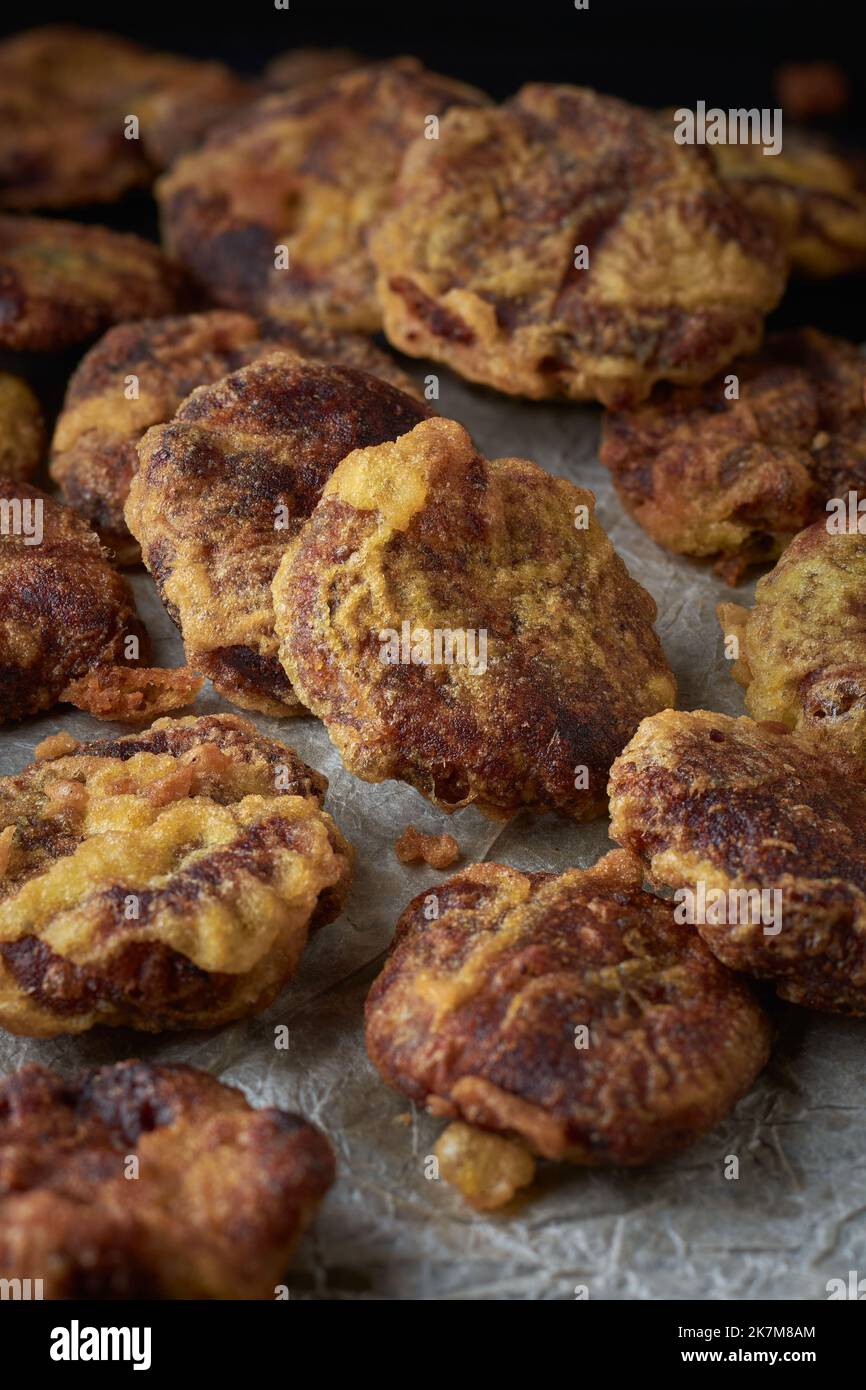 homemade mung bean sweets scattered on a tray, also known as mung kavum