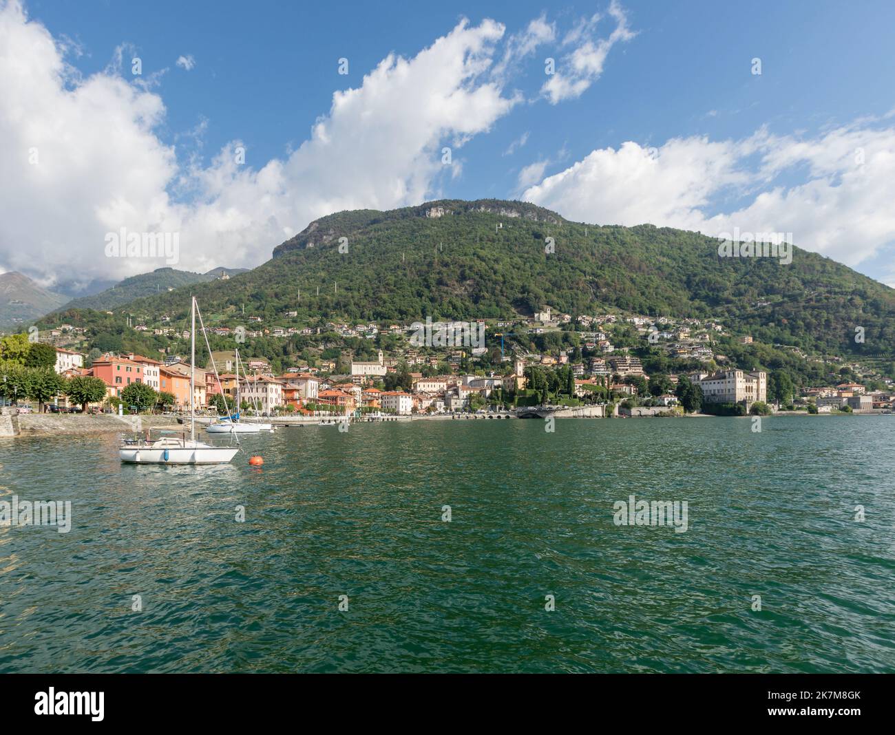 Town of Gravedona ed Uniti on Lake Como, waterfront with Palazzo Gallio, sail boats in foreground Stock Photo