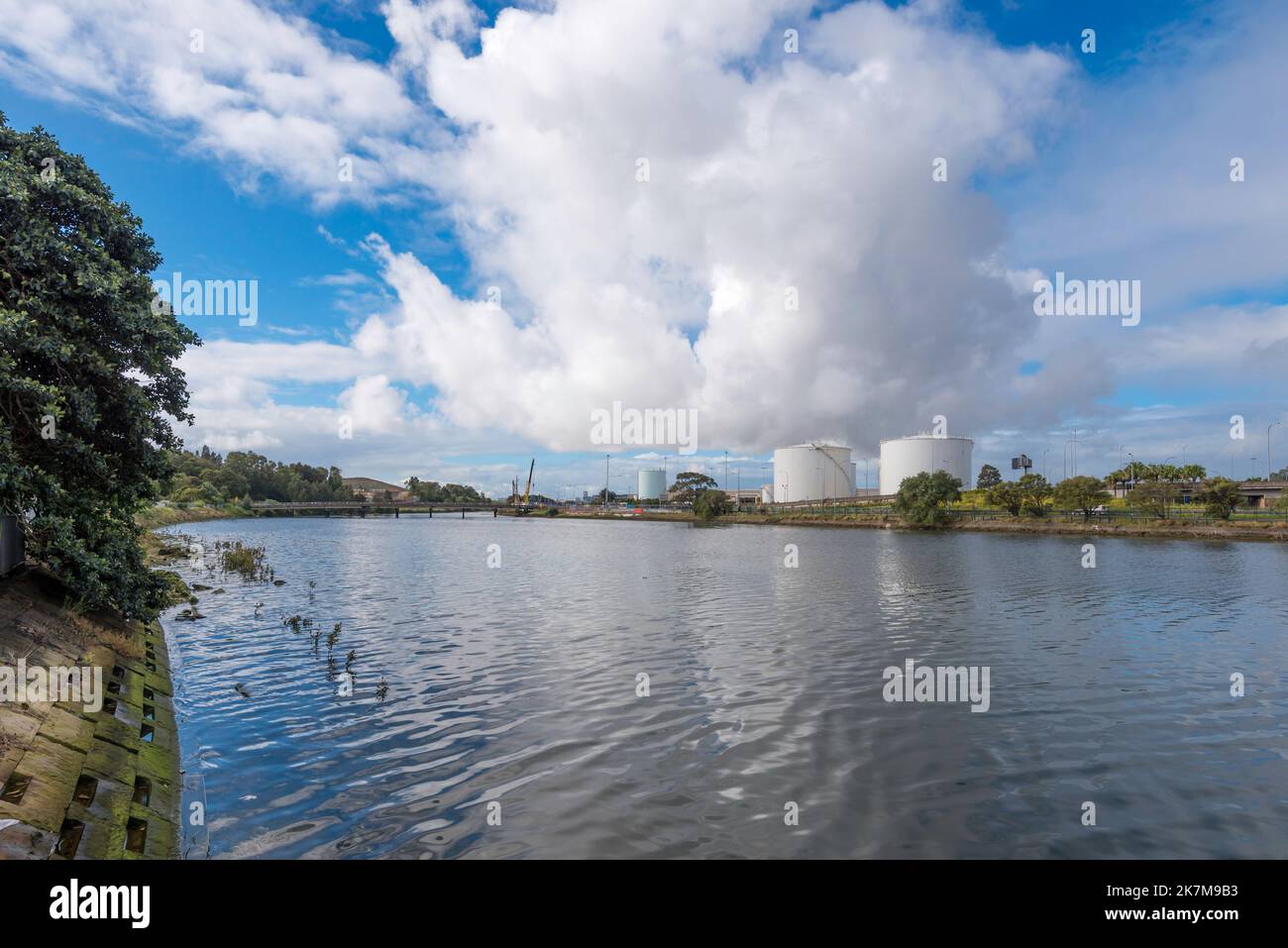 Bulk fuel tanks at Sydney Airport Cargo Terminal viewed across the Alexander Canal from Tempe Recreational Reserve in Sydney, Australia Stock Photo