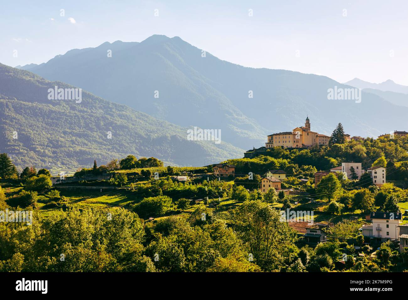 Rural landscape and village of Sant'Anna outside of Sondrio, Valtellina, Italy, with Convento di San Lorenzo Stock Photo