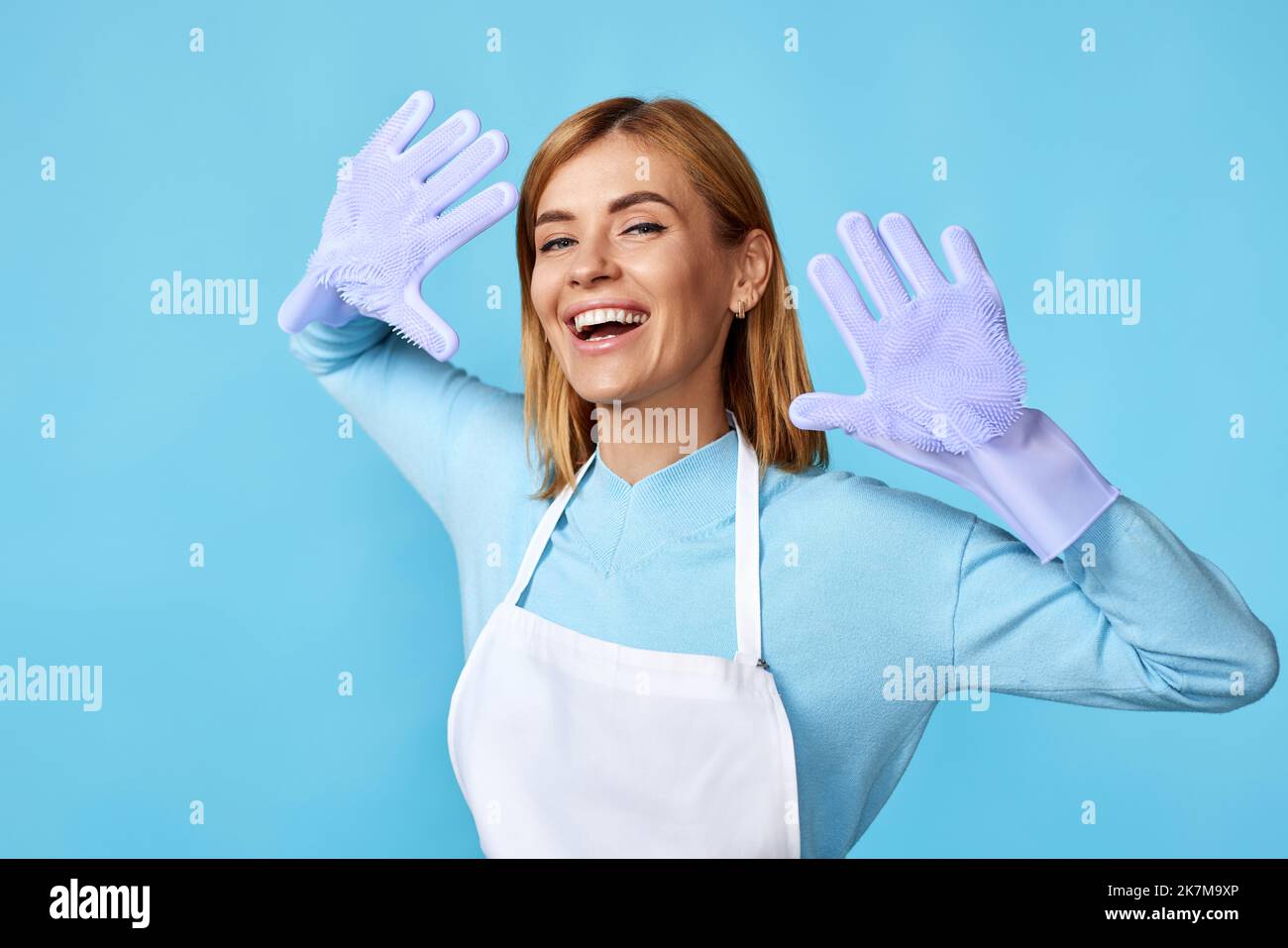 pretty woman in rubber gloves and cleaner apron Stock Photo - Alamy