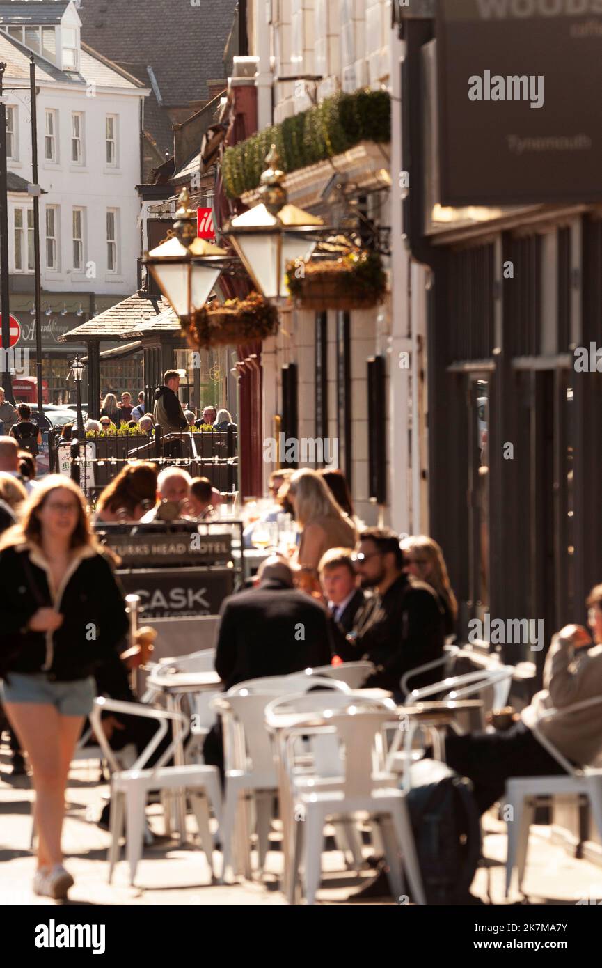 People eating and drinking outside the Turks Head hotel on Front Street, Tynemouth, Tyne and