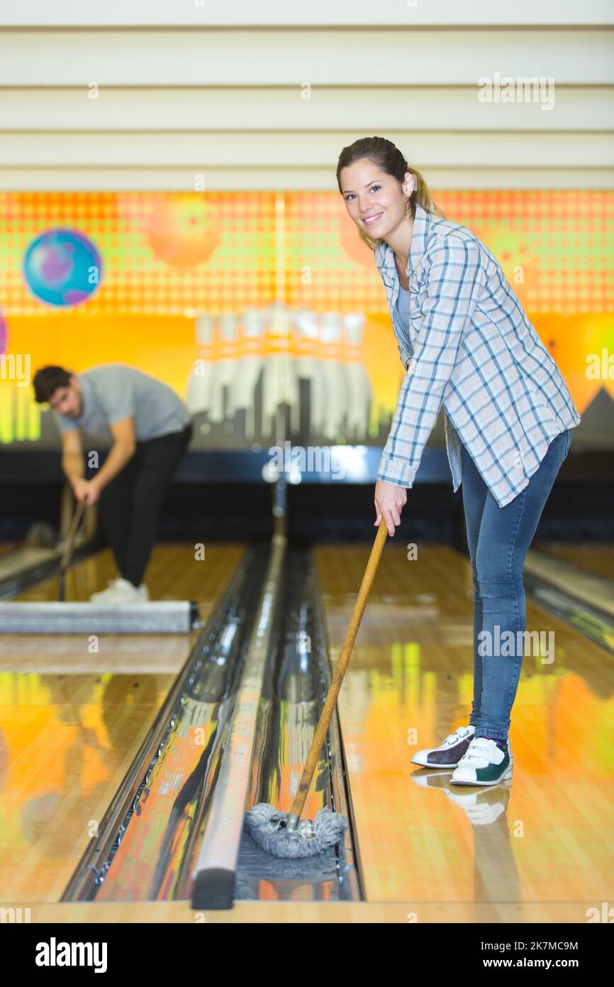 bowling staff moping the gutter Stock Photo Alamy
