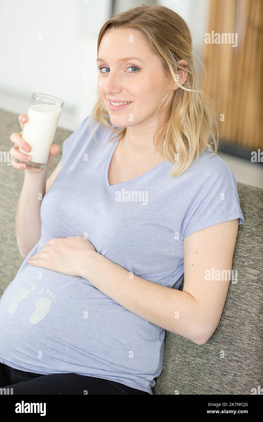 pregnant woman drink of milk at home Stock Photo Alamy