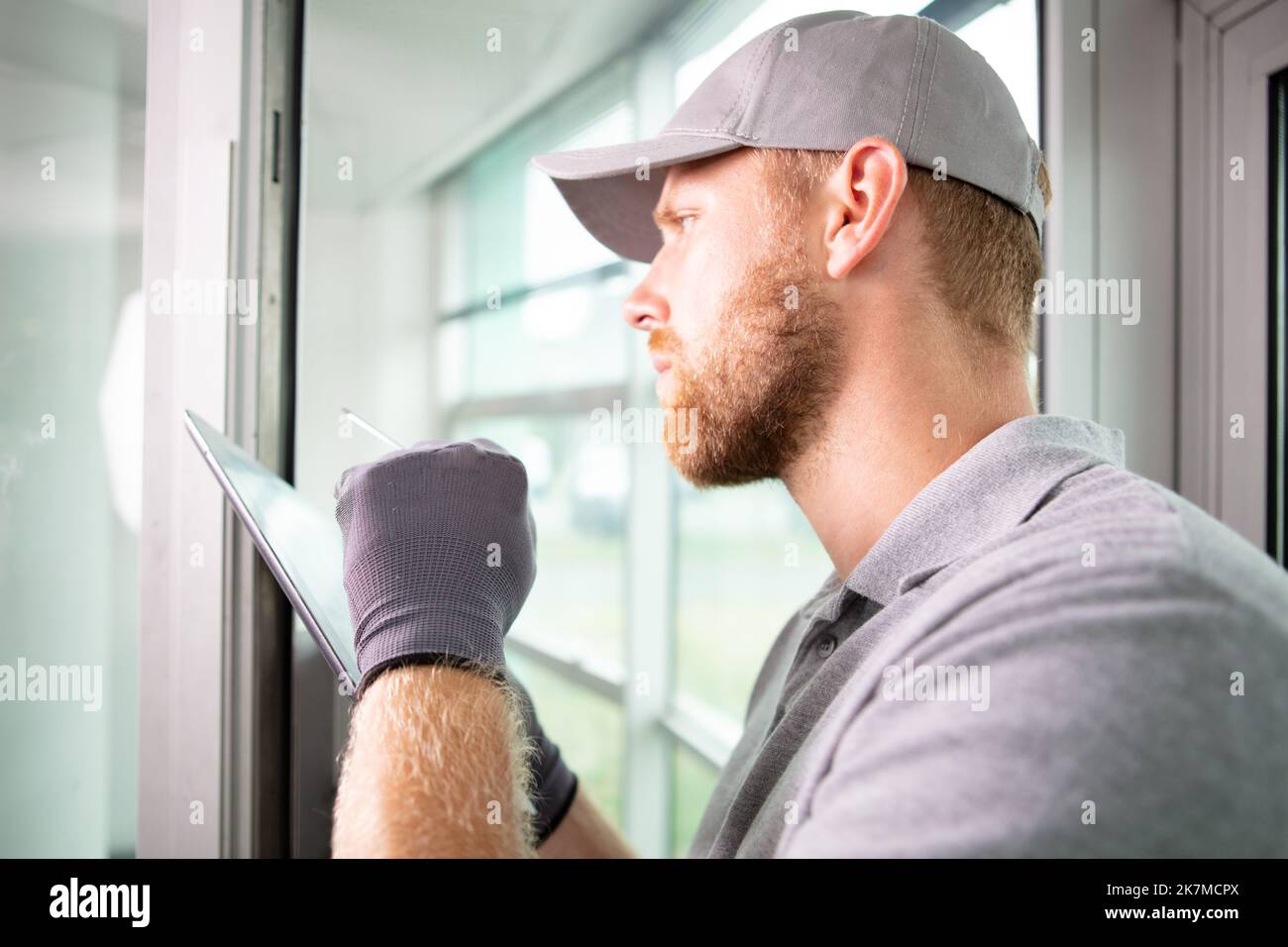 male glazier using a tablet Stock Photo