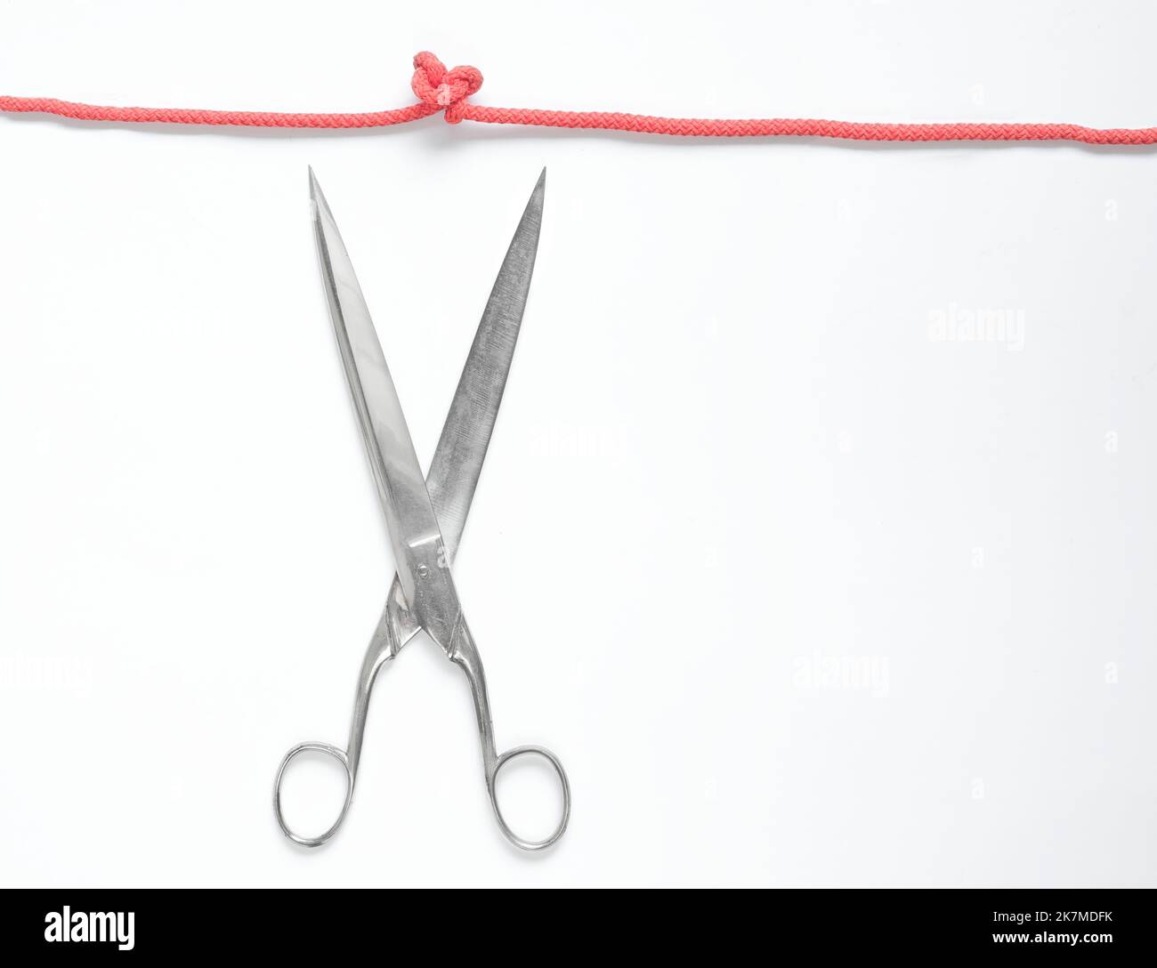 knot with string and scissors,business metaphor or problem solution concept.Solving a problem,unleash creativity,ideas,innovation, good copy space Stock Photo