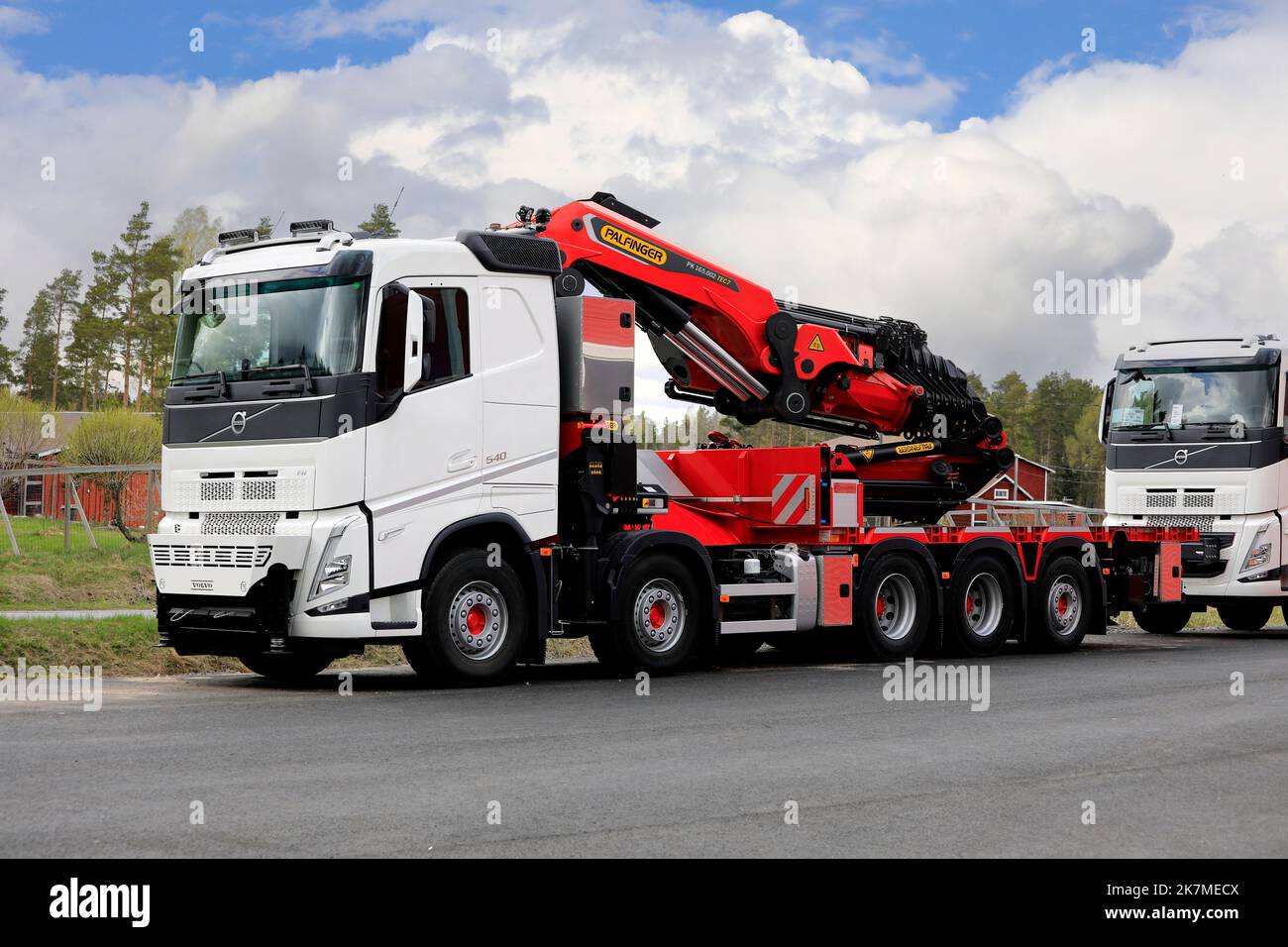 New, white Volvo FH 540 boom truck with Palfinger PK 165.002 TEC7 crane parked on a yard. Somero, Finland. May 14, 2022. Stock Photo