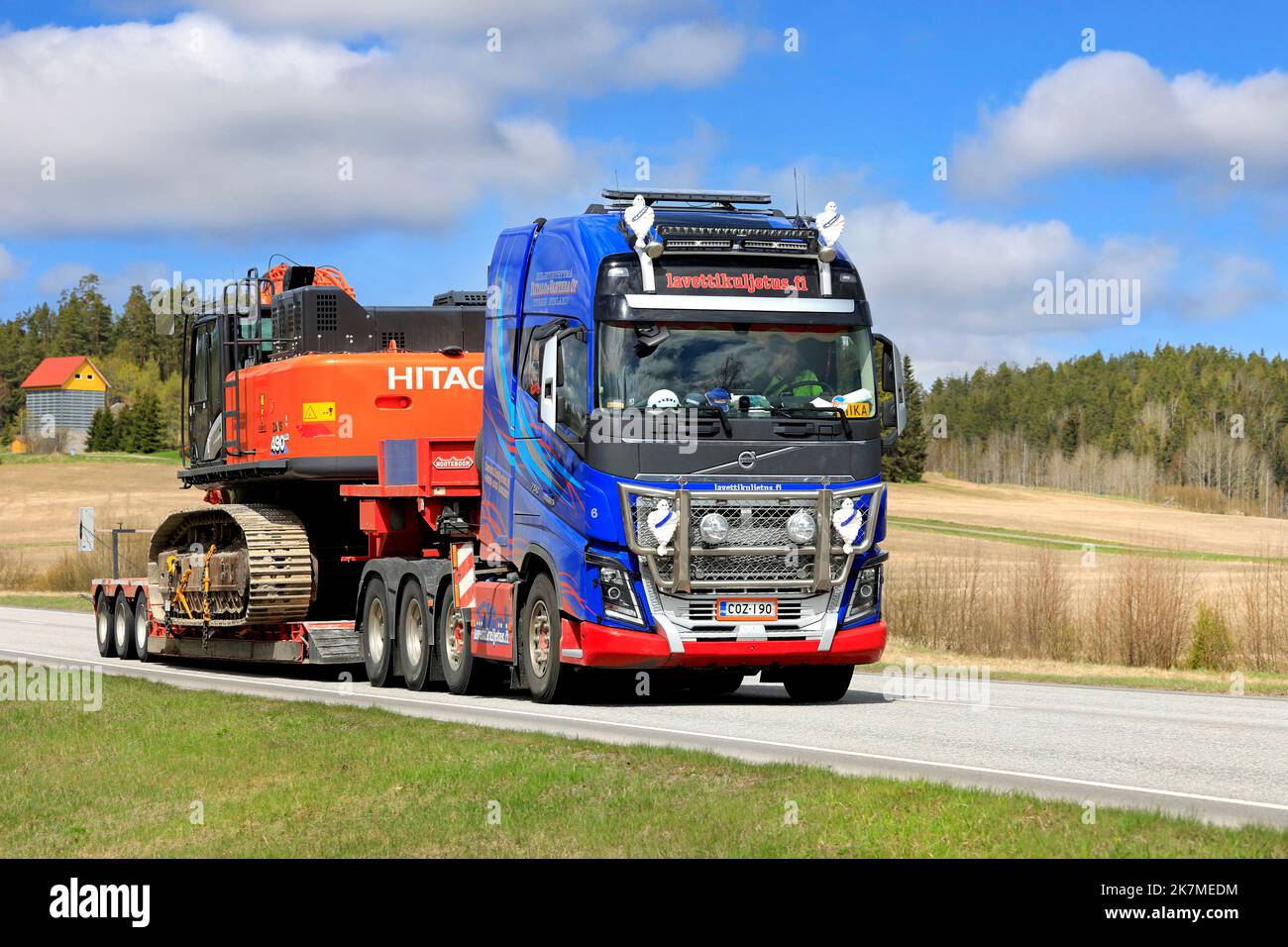 Volvo FH16 750 semi trailer of Lavettikuljetus Ylitalo & Vahtera Oy hauls Hitachi Zaxis 490 LHC hydraulic excavator. Salo, Finland. May 13, 2022. Stock Photo