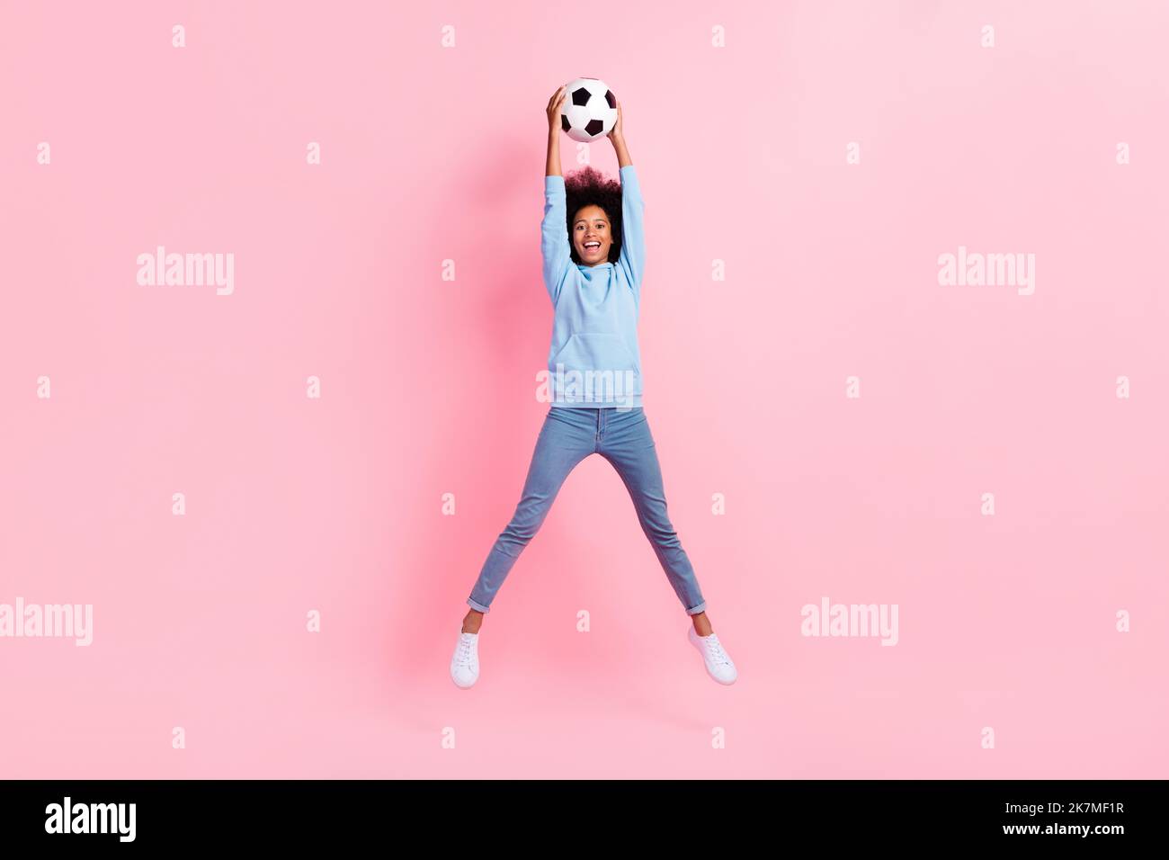 Full length photo of excited energetic person jumping hands catch hold