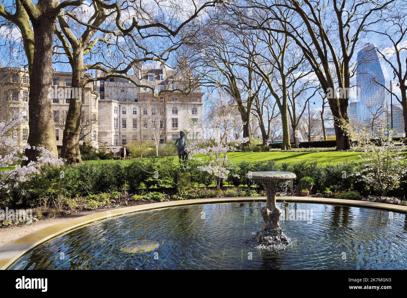 The Pond Garden with water feature and statue in grounds of The Inner Temple Garden in early spring, Victoria Embankment, City of London, England, UK Stock Photo