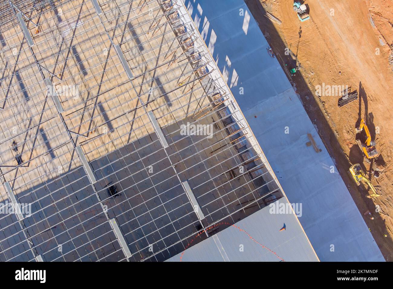 Under construction warehouses on building site there is metal steel framework Stock Photo