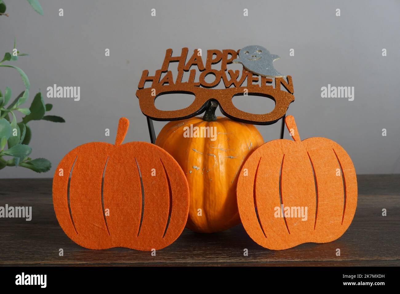 halloween concept with glasses, pumpkin, cones and candles Stock Photo