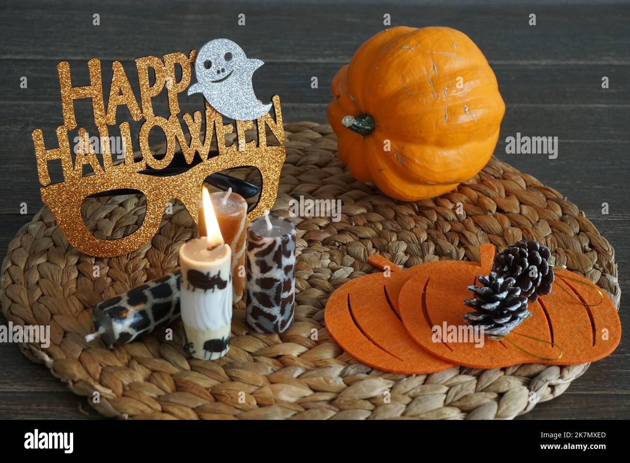halloween concept with glasses, pumpkin, cones and candles Stock Photo