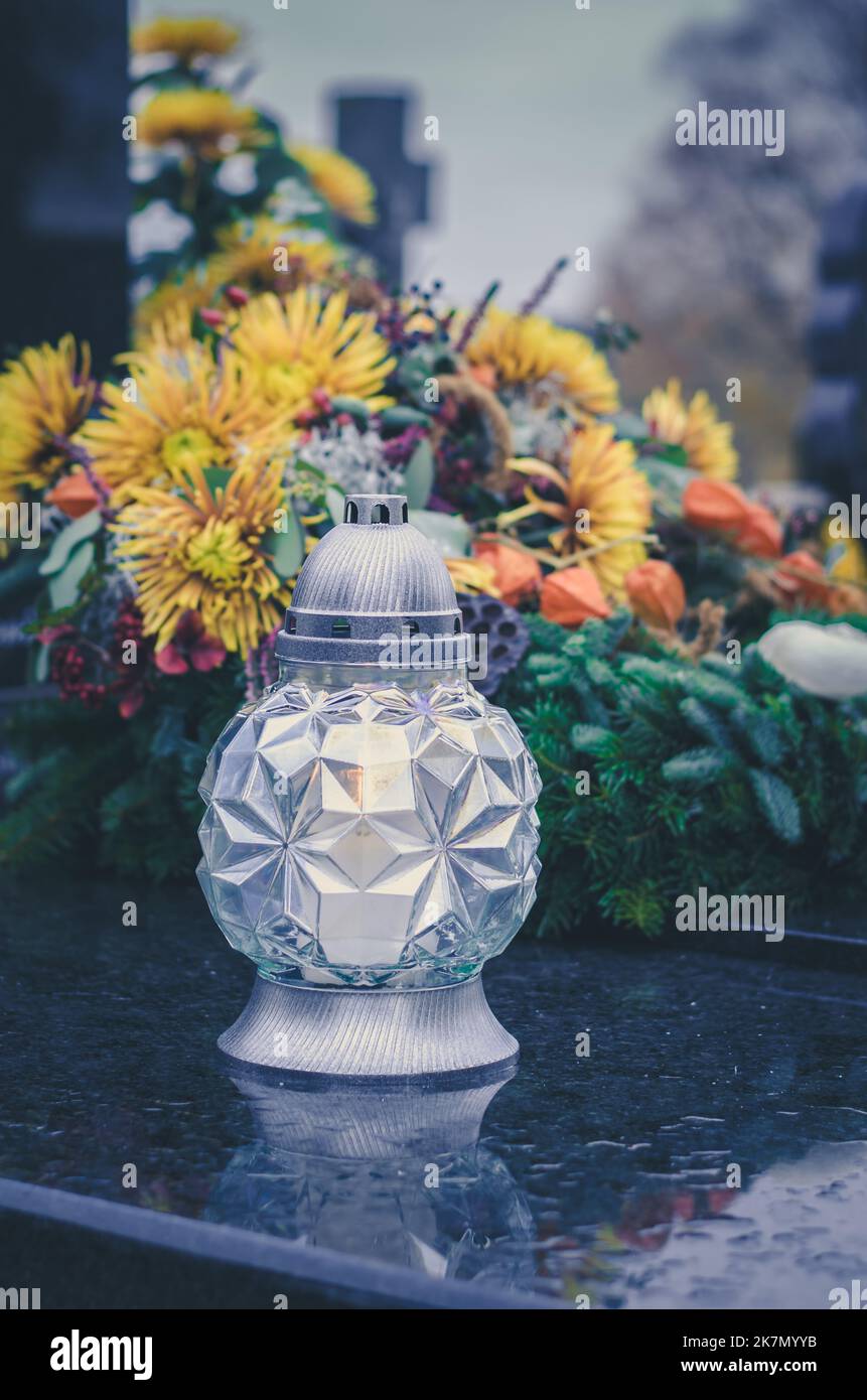 decorated graves and crosses during all saints day on cemetery Stock