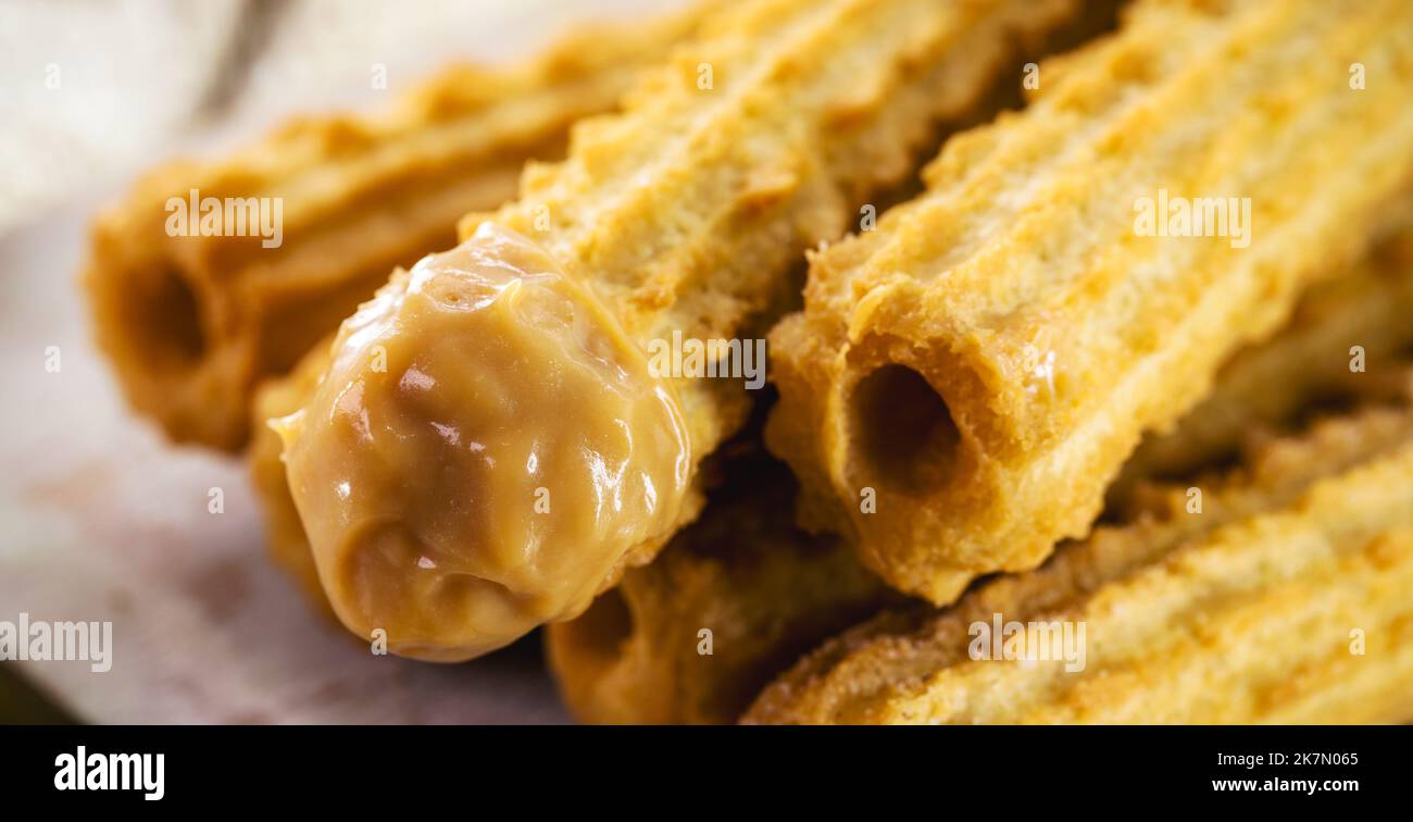 Churros, typical fried sweet from Brazil, Mexico and Spain. Sprinkled ...
