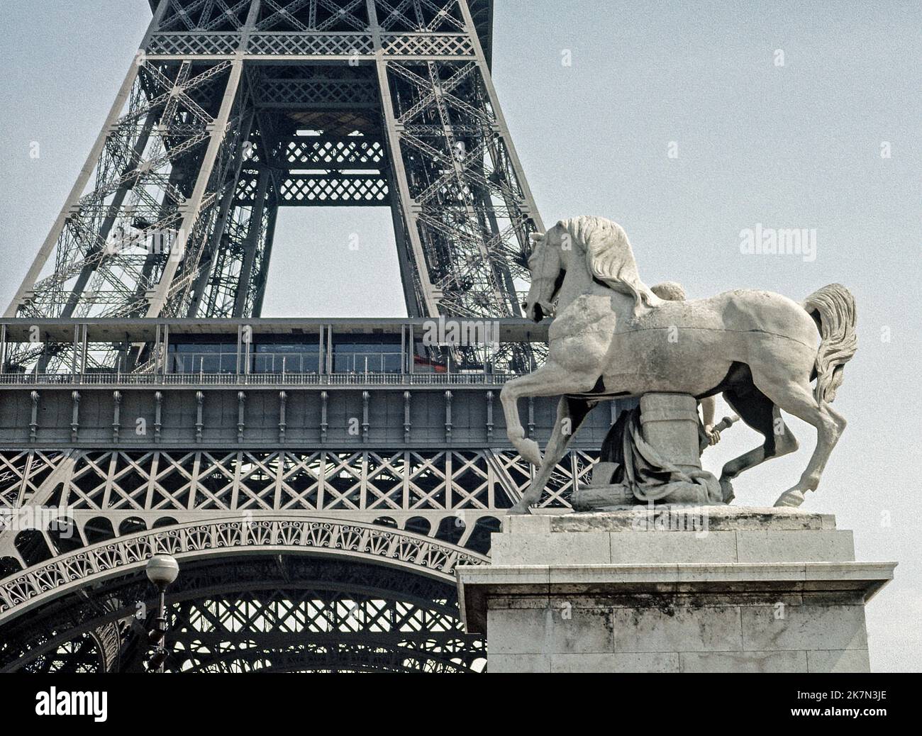 Eiffel Tower Paris with horse statue to the fore. Archival shot scanned from transparency; 1972 Stock Photo