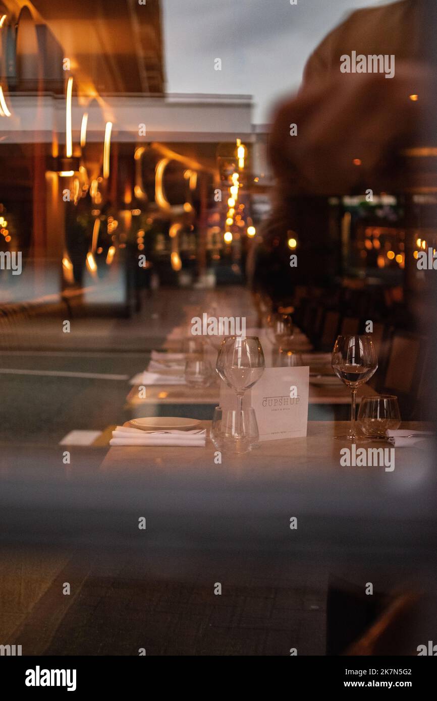 A vertical of a cozy interior of a posh restaurant in Hale Village