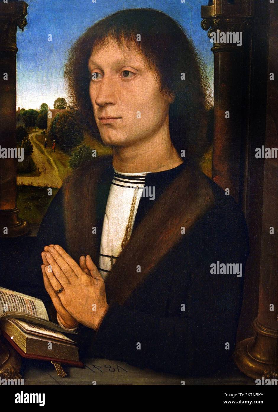 Benedetto Portinari triptych: Right wing 1487  Portrait of a Praying ManBenedetto Portinari 1487 Hans Memling (Memlinc ) 1430 –1494 German painter who moved to Flanders and worked in the tradition of Early Netherlandish painting. Stock Photo