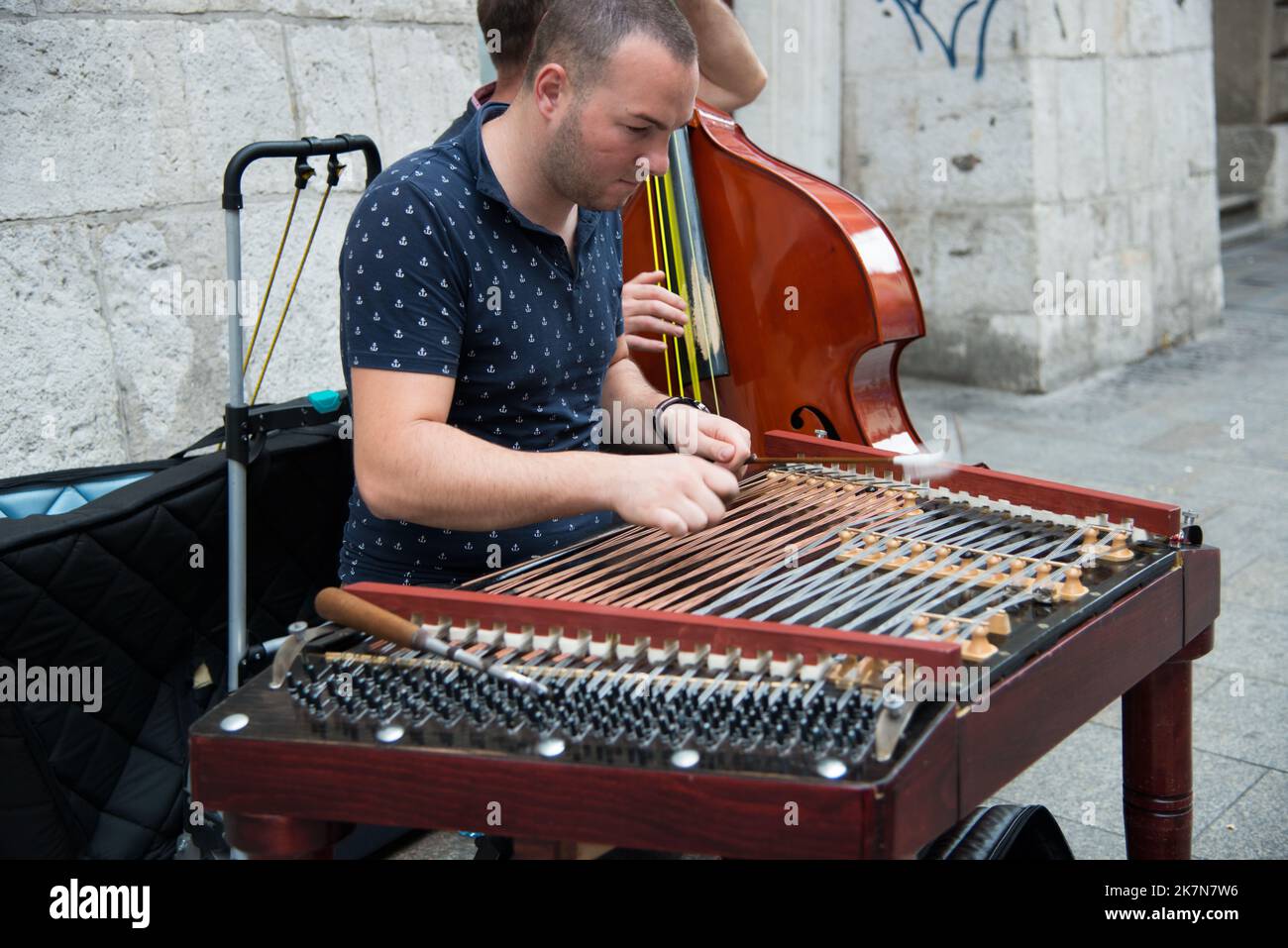 A man playing cimbalom instrument on a street in Krakow, Poland Stock Photo