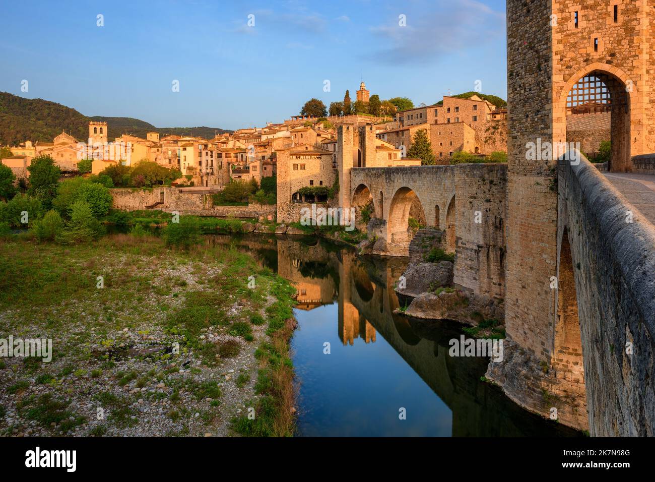 Historical bridge and medieval Old town of Besalu, Catalonia, Spain, in sunrise light Stock Photo