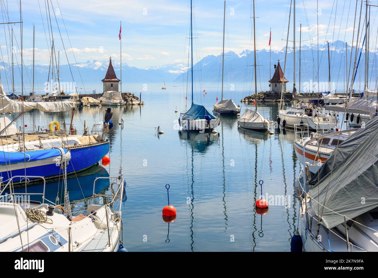 Yacht port in Morges town near Lausanne city, Switzerland, view of the Alps mountains and Lake Geneva Stock Photo