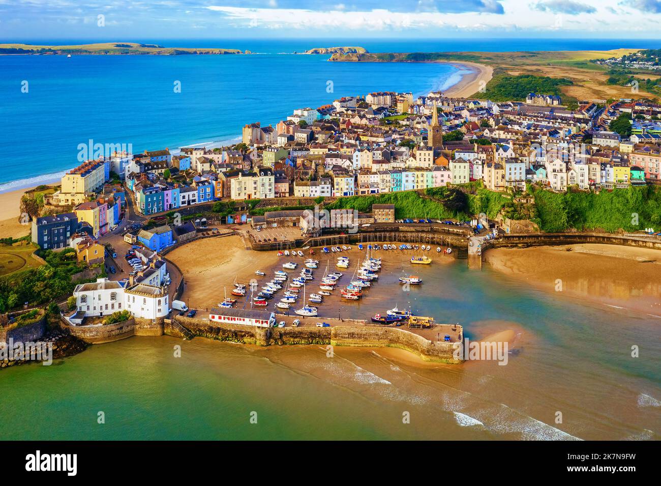 The port and the sand beaches in the Old town of Tenby, a popular resort town famous for its colorful traditional houses and sand beaches in Pembrokes Stock Photo