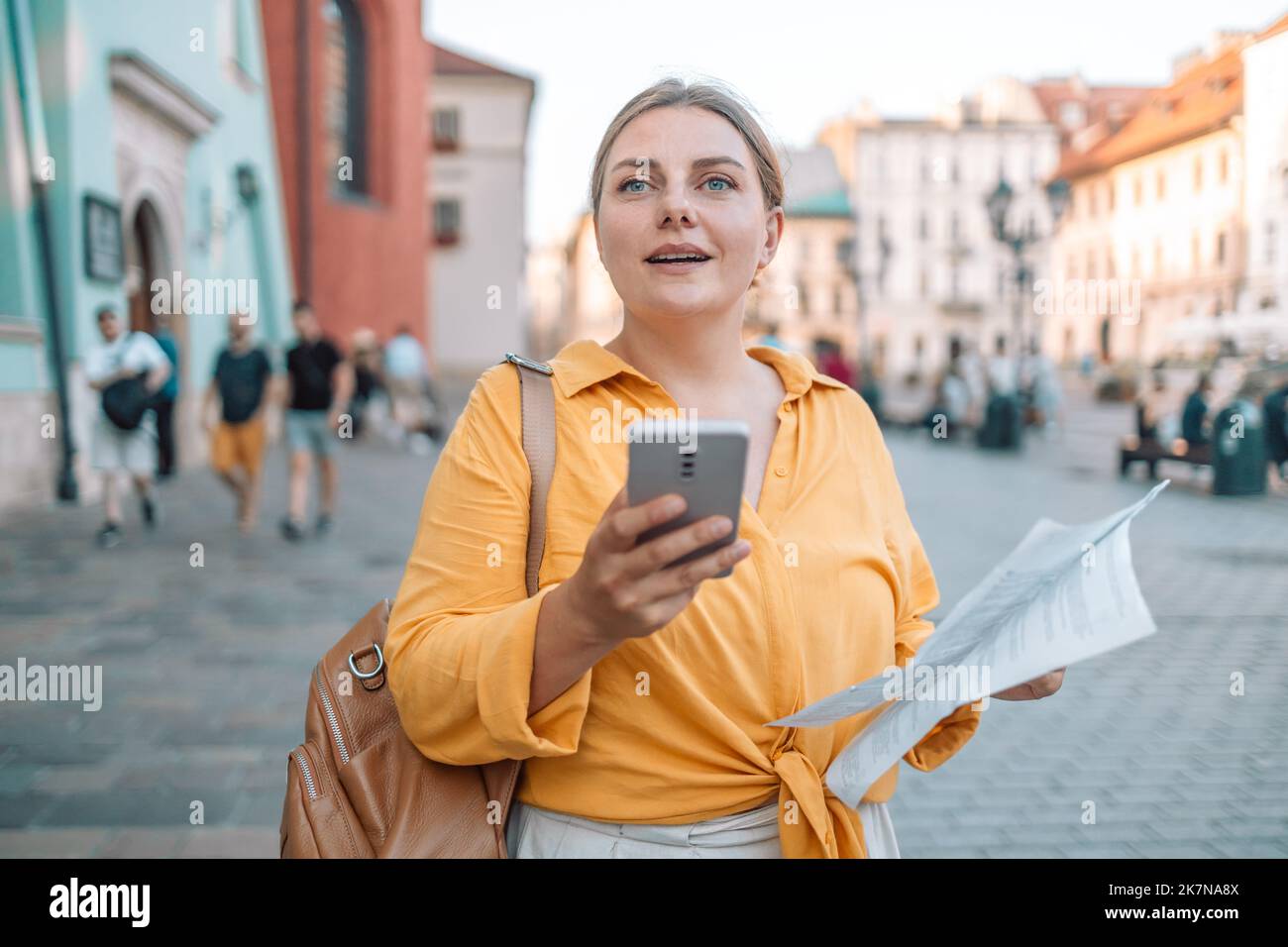 Beautiful girl tourist traveler using smart phone with navigation app ...