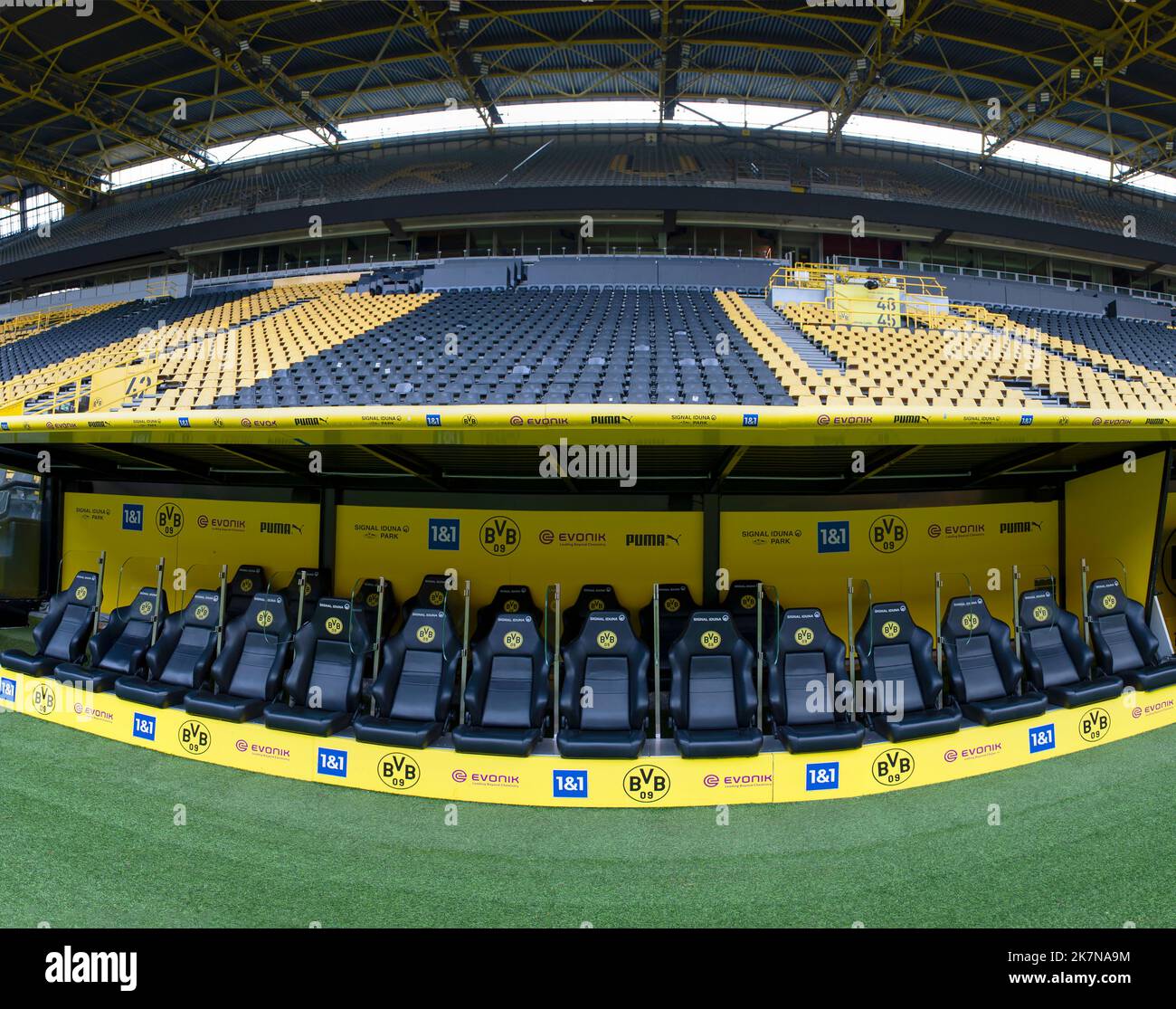 Teams staff bench at Signal Iduna Arena - the official playground of FC Borussia Dortmund Stock Photo