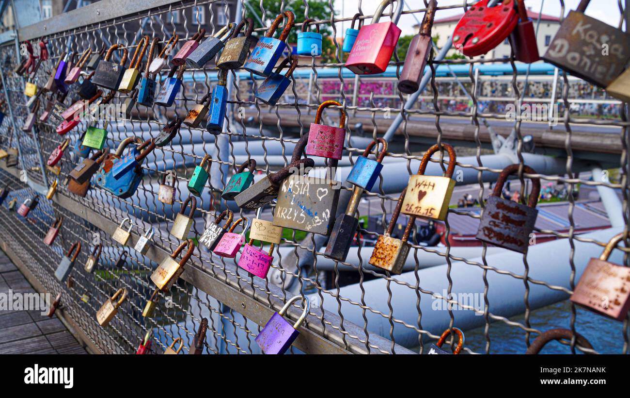 Love Lock Padlocks on Bridge with Lovers and friends initials on it in