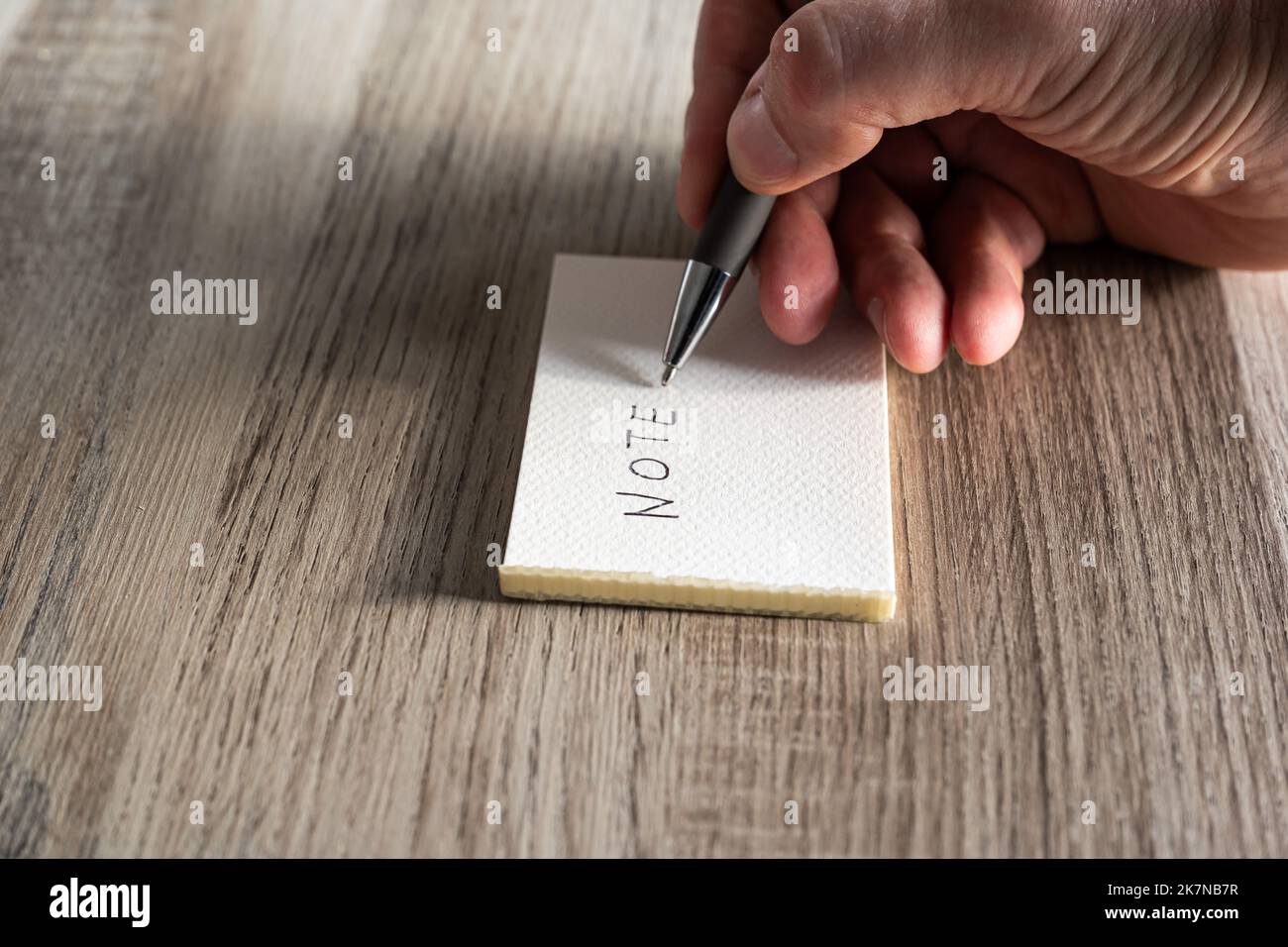 White business man writing a note on a paper, Belgium Stock Photo