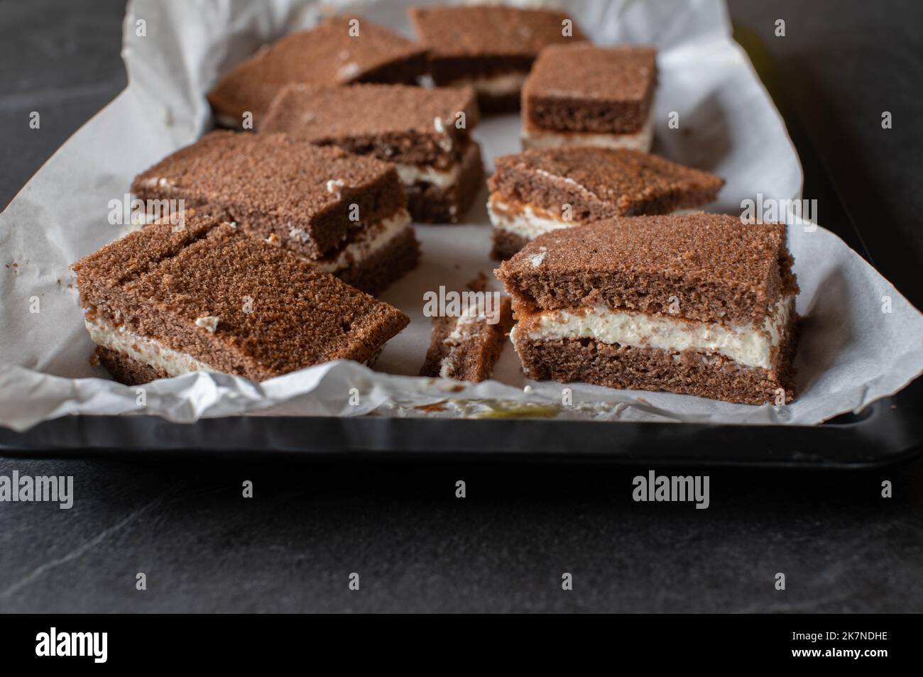 Milk slice cake on a baking tray. Traditional german chocolate sheet cake Stock Photo