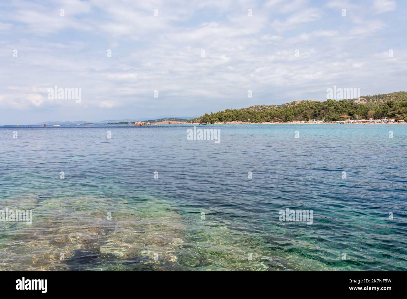 Beautiful Kalogria beach and moody sky. Summer vacation travel holiday ...