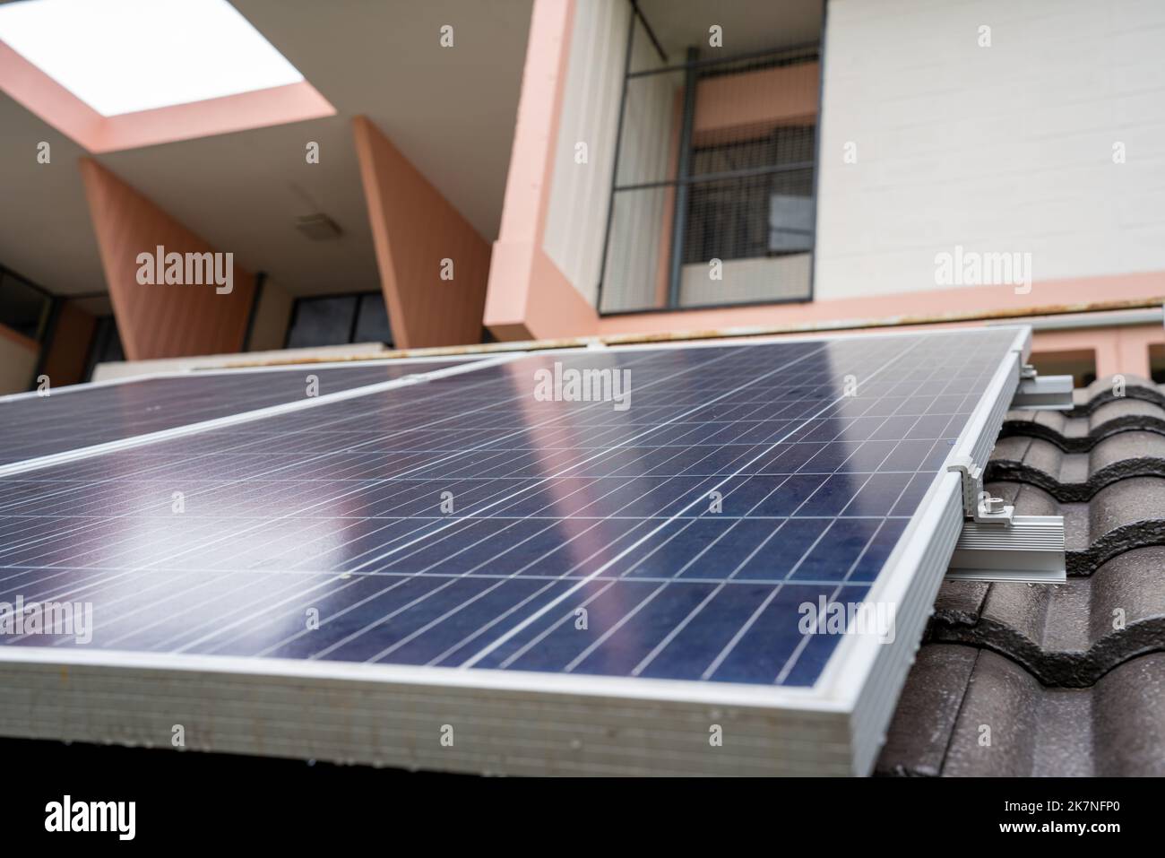 Blue Solar Photo voltaic panels system of apartment building on sunny ...