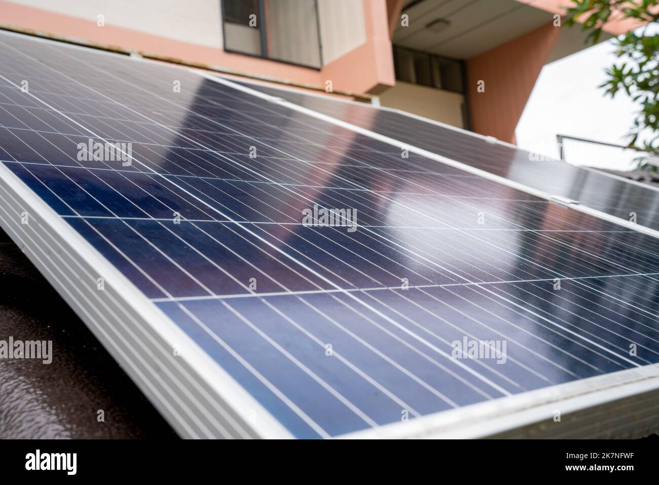 Blue Solar Photo voltaic panels system of apartment building on sunny