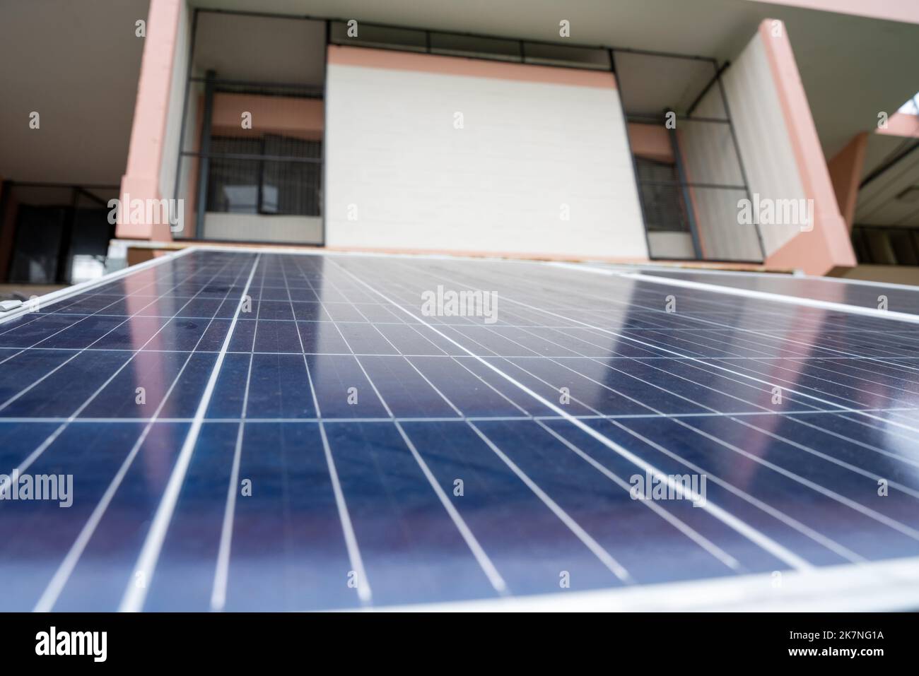 Blue Solar Photo voltaic panels system of apartment building on sunny