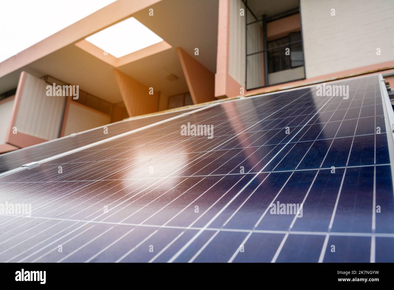 Blue Solar Photo voltaic panels system of apartment building on sunny