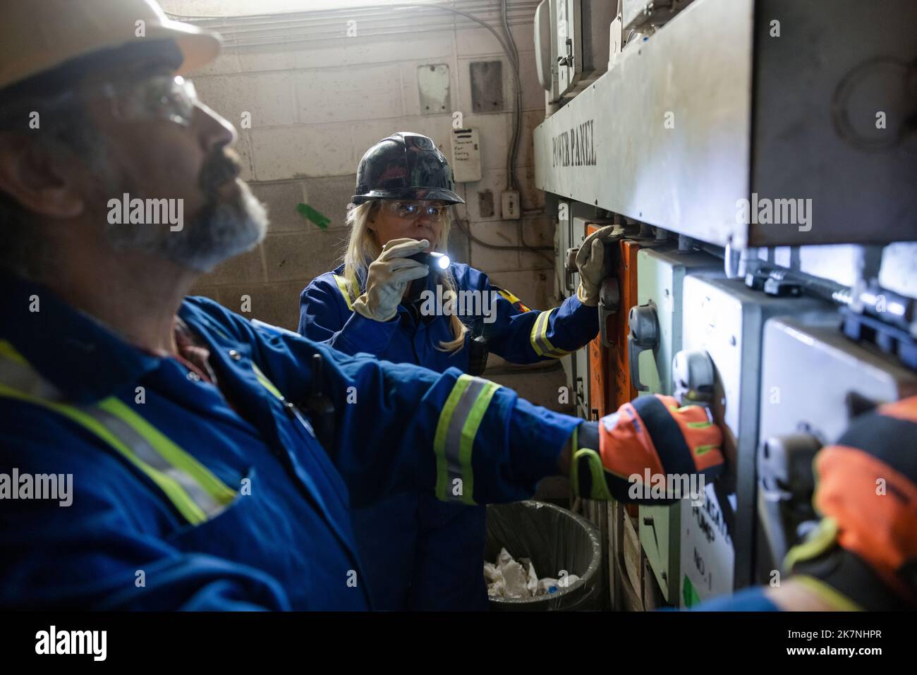 Construction workers inspecting electrical control room Stock Photo Alamy