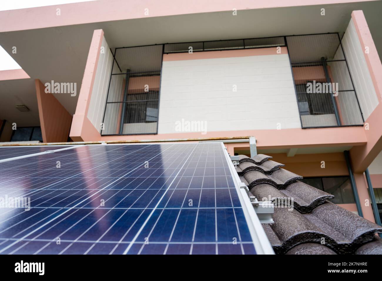 Blue Solar Photo voltaic panels system of apartment building on sunny