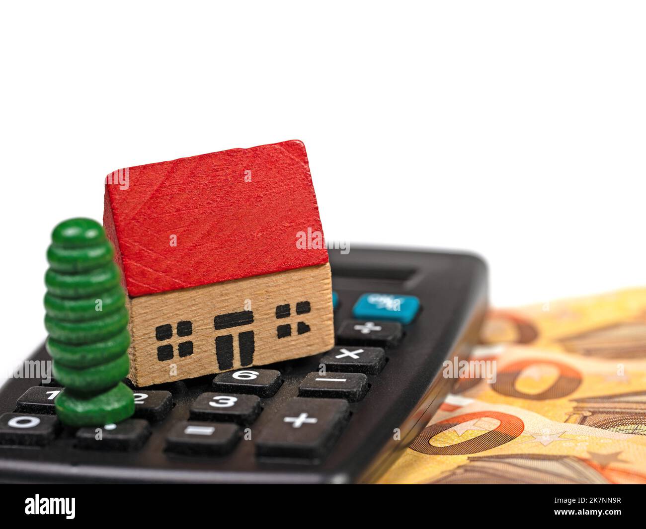 House and calculator symbolic of land tax Stock Photo Alamy