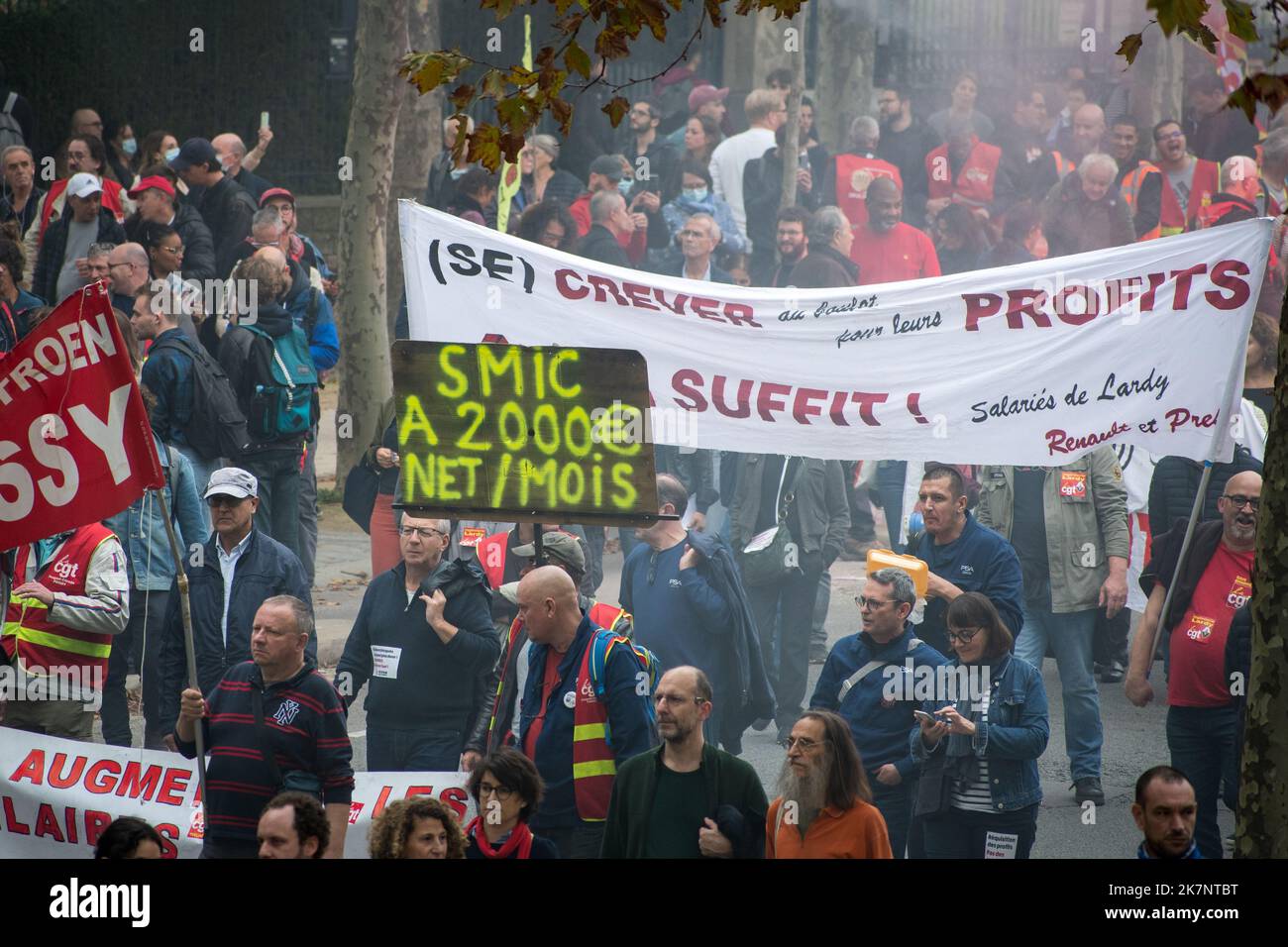 Paris, France, 18th October, 2022. Demonstrators march with placards and banners during a national day of strike and protests for higher wages - Jacques Julien/Alamy Live News Stock Photo