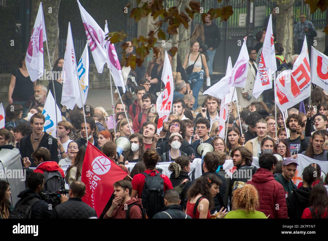 Paris, France, 18th October, 2022. Young demonstrators march with flags during a national day of strike and protests for higher wages - Jacques Julien/Alamy Live News Stock Photo