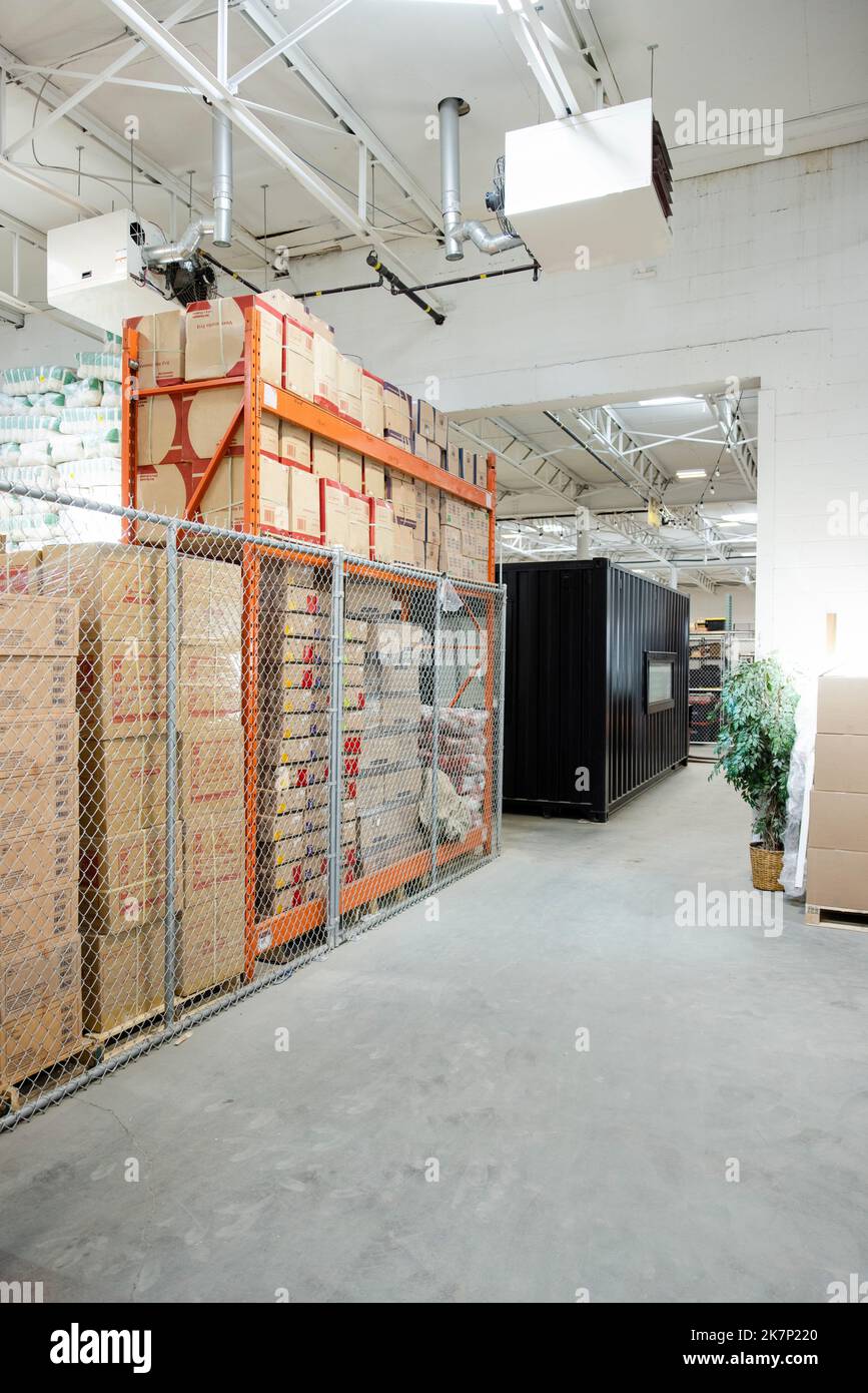 Stacked cardboard boxes in distribution warehouse Stock Photo