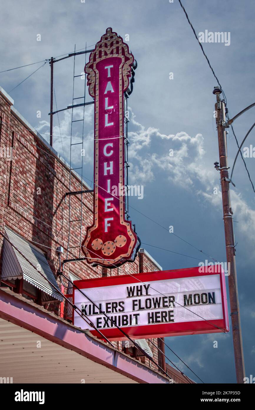 2022-03-16 Fairfax OK USA - Retro neon Tall Chief Movie sign over marquee reading Why Killers Flower Moon Exhibit Here in town where events of  movie Stock Photo