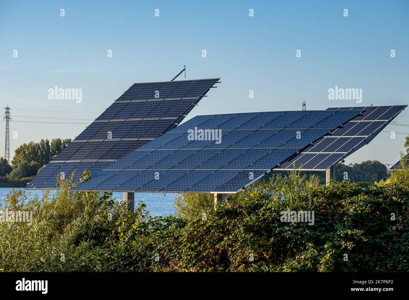 multiple solar panels against a blue sky Stock Photo