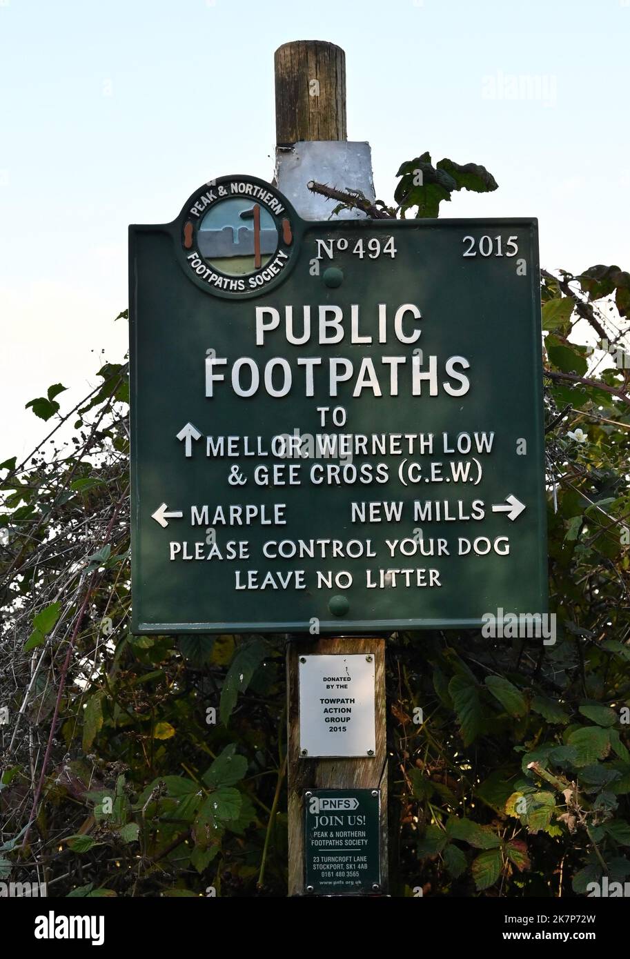 A sign showing public footpaths accessible from the Peak Forest Canal near Disley, Cheshire Stock Photo