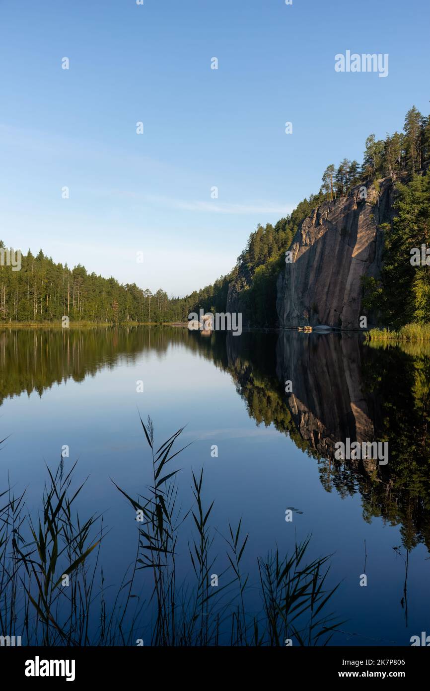 Olhavanvuori (Olhava Mountain), rising 50 meters up from the water in Repovesi National Park. Popular rock climbing location in Southern Finland. Stock Photo