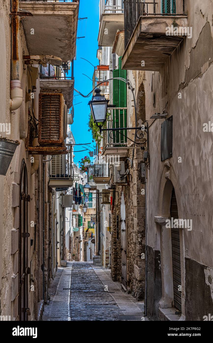 Characteristic alley with the classic staircase and balconies of the city of Vieste. Vieste, Foggia province, Puglia, Italy, Europe Stock Photo