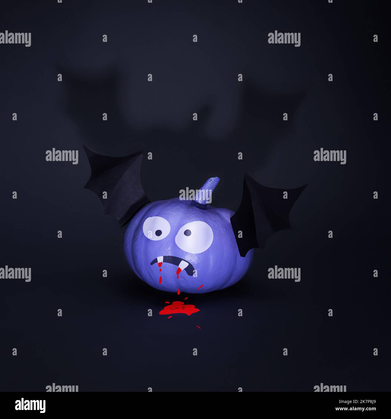 Happy Halloween, funny pumpkin bat with a creepy grimace, fangs with blood on a black background. Creative backdrop concept for halloween party poster Stock Photo