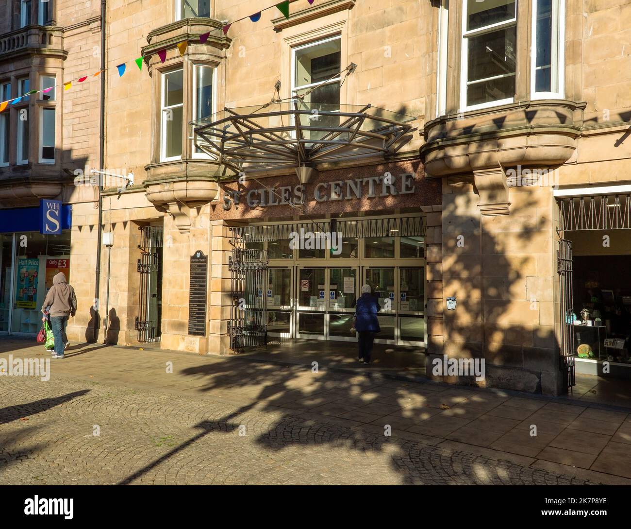 Lady entering the St Giles Shopping Centre in the town centre of Elgin